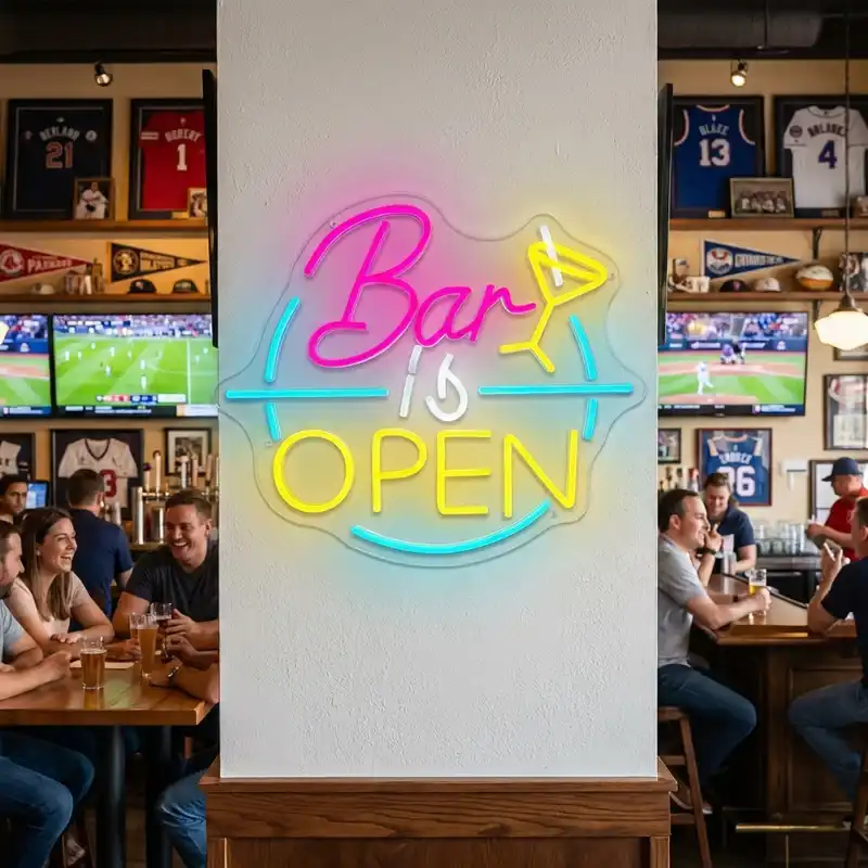 Colorful Bar Is Open LED neon sign on a white wall inside a lively sports bar interior
